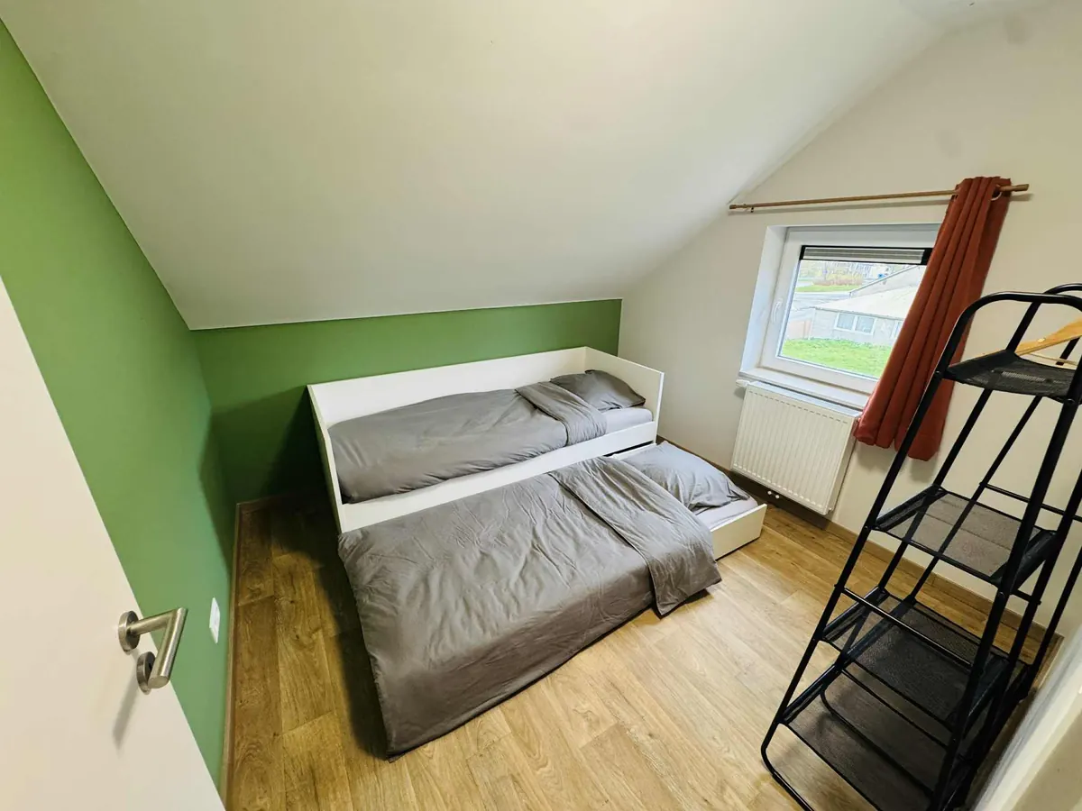Espace de vie chaleureux et cosy du gîte Le Cocon de Pernelle à Couvin